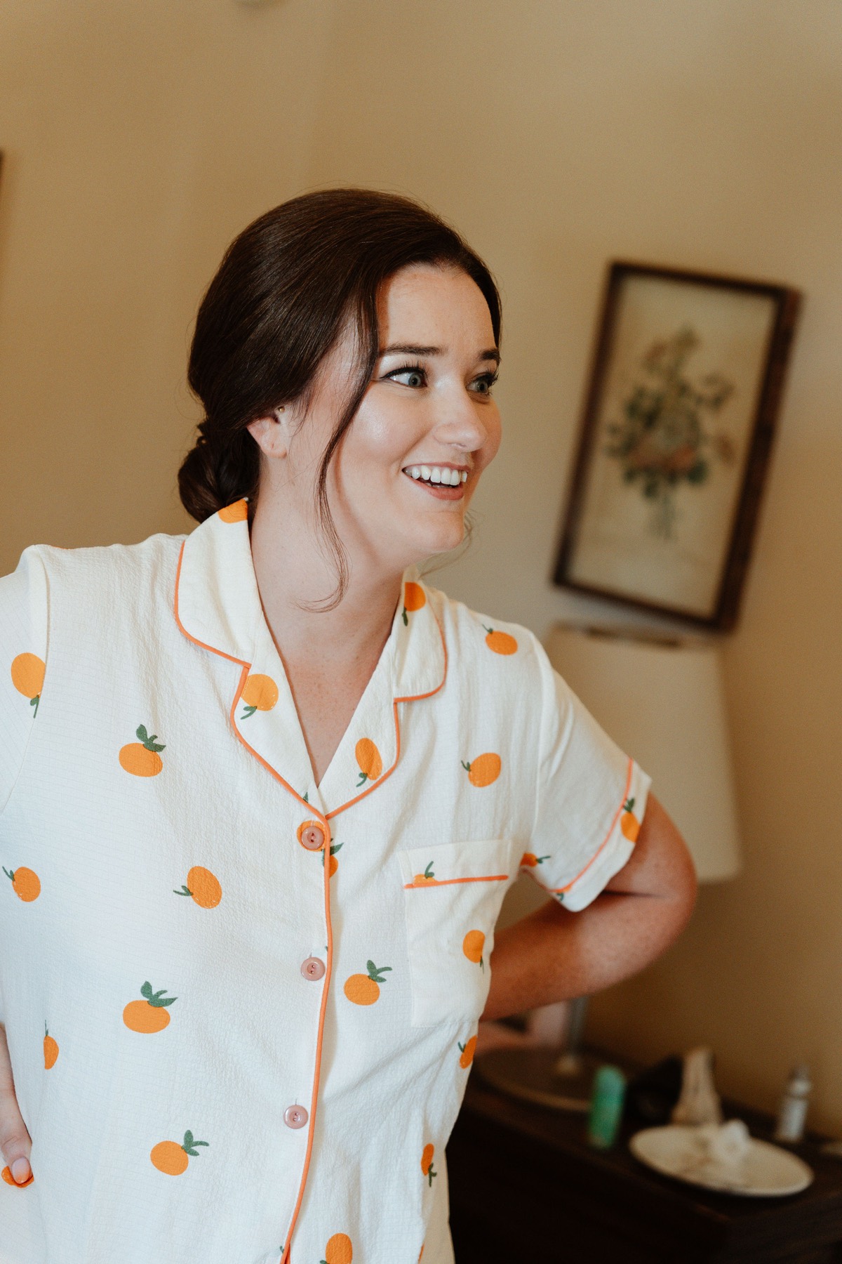 Róisín laughing in orange-print pyjamas, getting ready