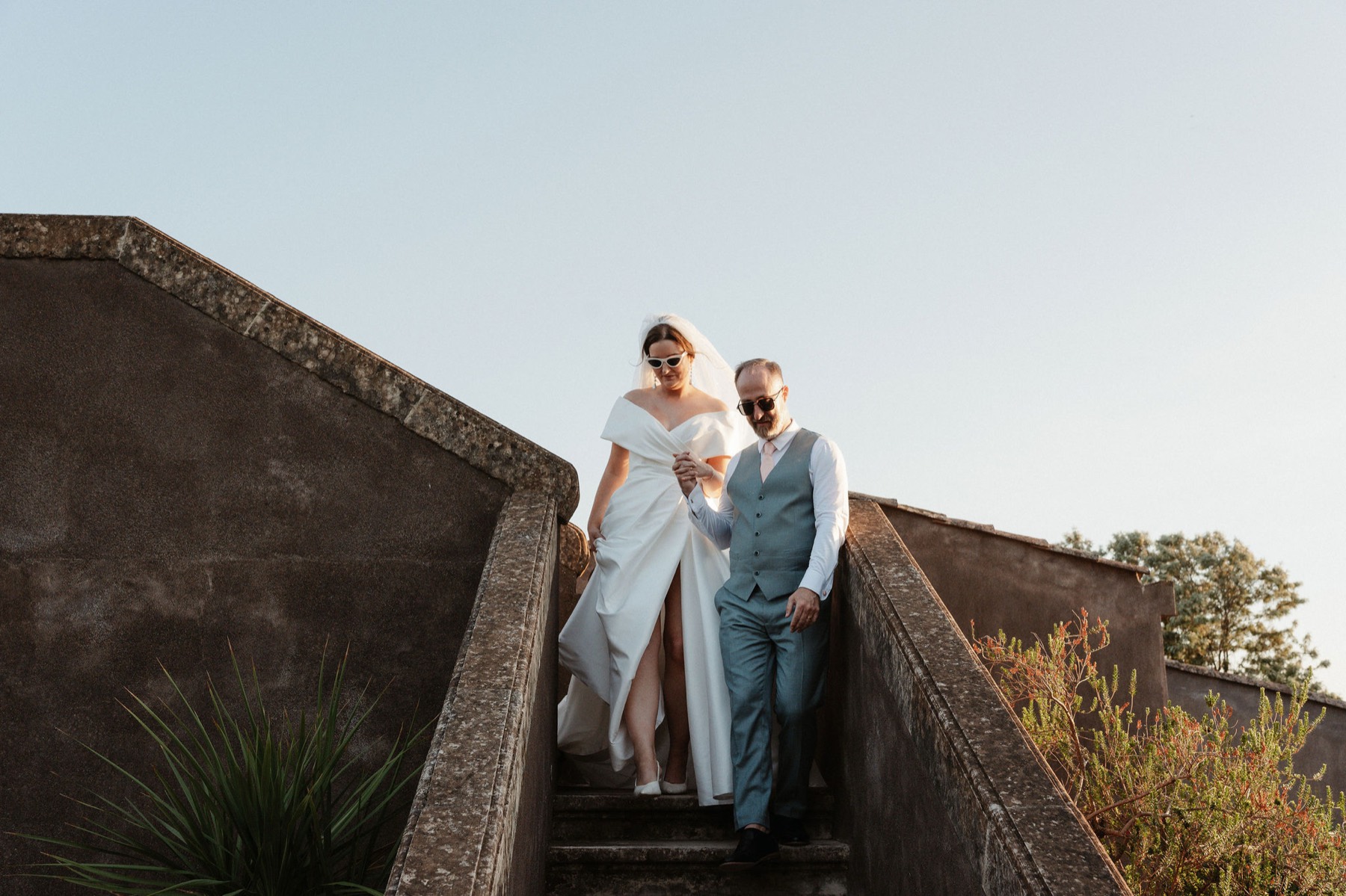 Róisín and Ken on the lava-stone staircase at golden hour